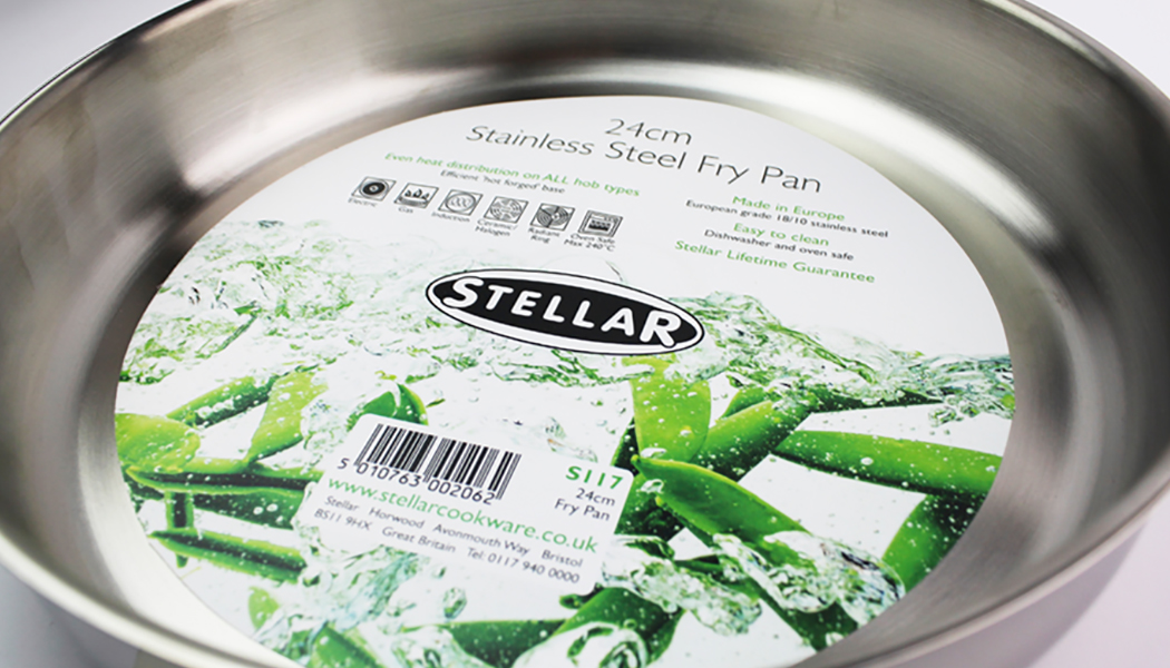 Close-up of Stellar stainless steel frying pan including label design