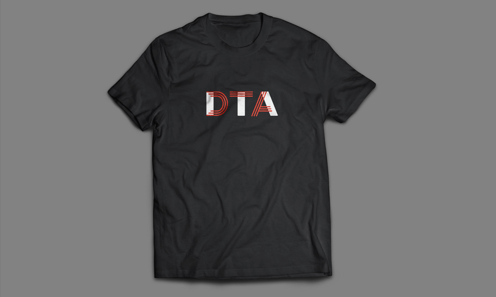 Animation showing two t-shirt designs for Devon theatre arts. The letters 'DTA' are red and white on a black t-shirt