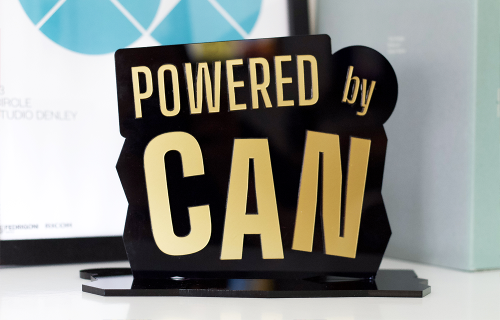 Trophy award design of the powered by can logo